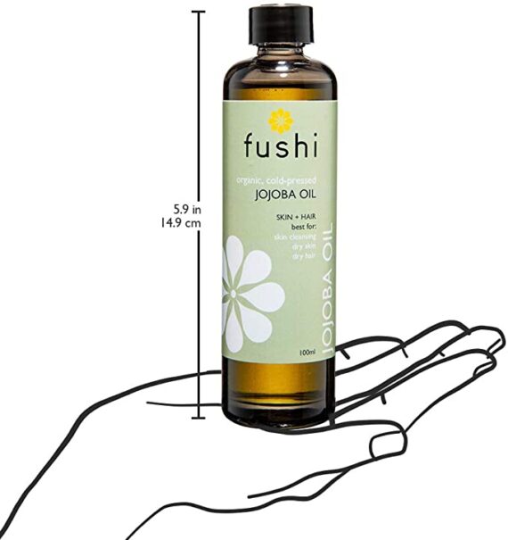 jojoba-oil-bottle-on-hand